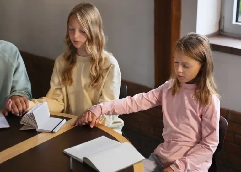Foster girls praying together