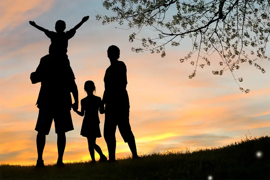 outline of a family walking on a hike